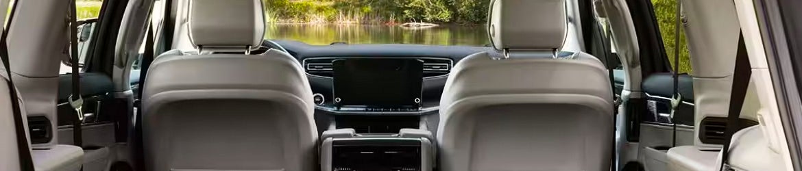 A view over the dash of a 2024 Jeep Wagoneer of a lake near Pleasanton, TX